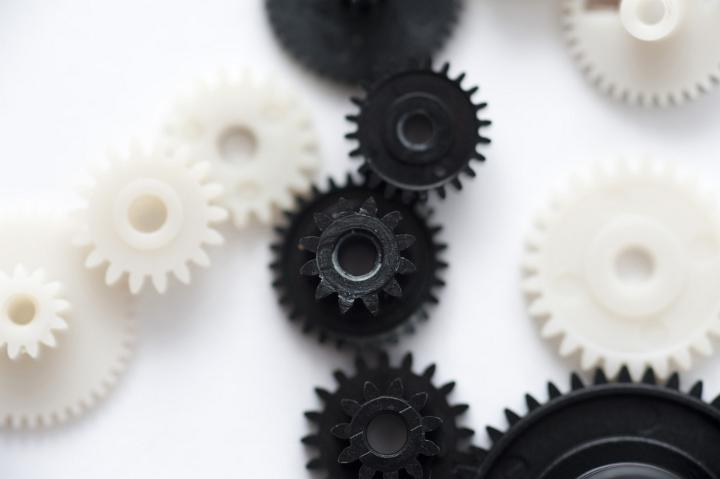 conceptual teamwork image of a series interconnected gear wheels