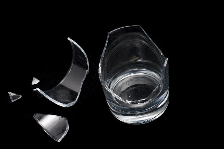Close up Shot of Conceptual Broken Glass Isolated on Black Background