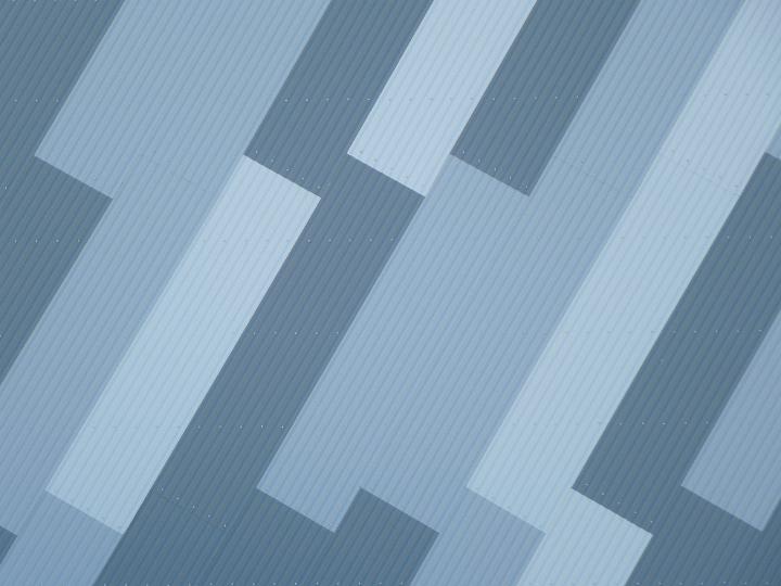 Decorative blue exterior building cladding in a striking diagonal geometric design in a full frame architectural background