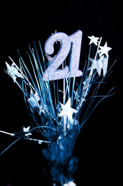 21st Birthday Party Concept Design, Emphasizing 21 Number with Starburst on Black Background