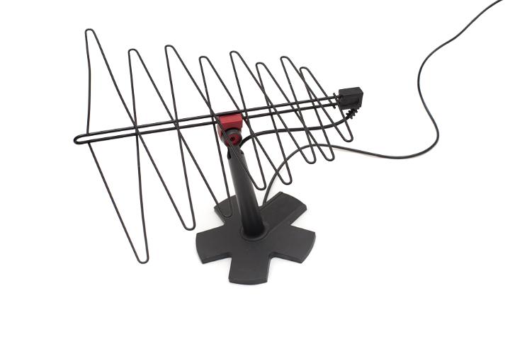 Portable interior freestanding TV antenna with attached cable isolated on white