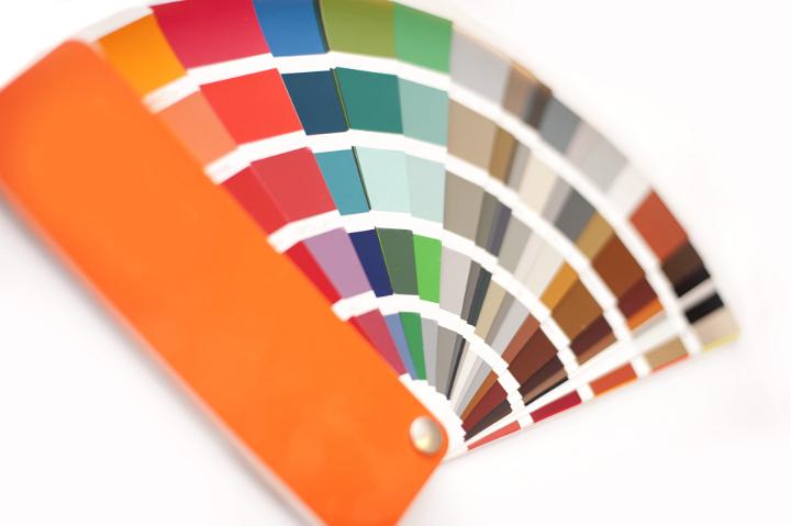 Color picker for interior decorating with swatches in the colors of the spectrum fanned out on a white background