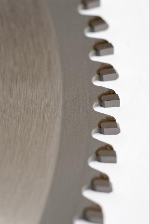 Teeth of circular saw metal wheel in close-up