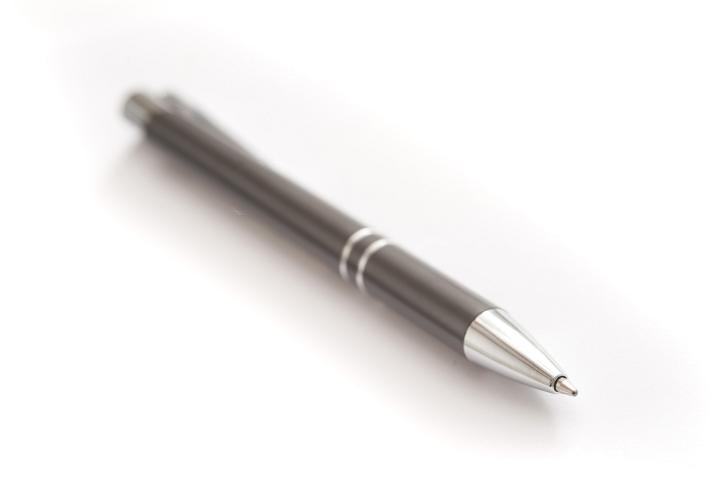 Close up Single Black Ballpoint Pen or Biro Isolated on White Background