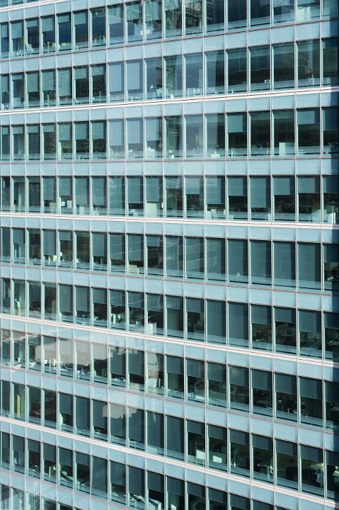 Offices of a Modern High Rise Architectural Building with Glass Windows.