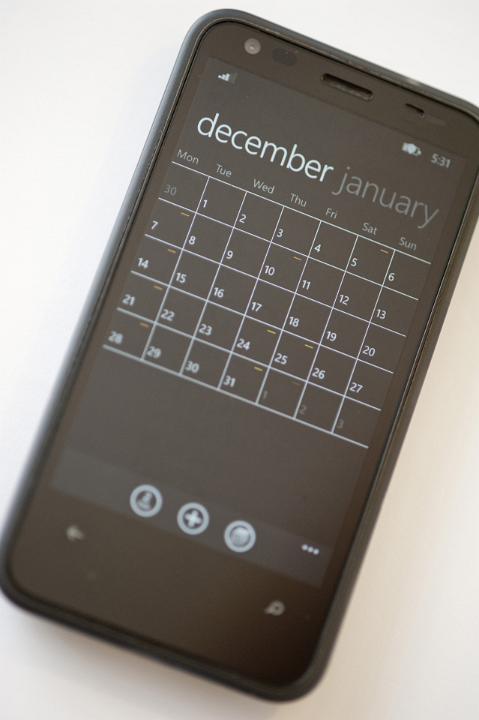 Close up Black Touch Screen Mobile Phone with Agenda Application Isolated on White Background.