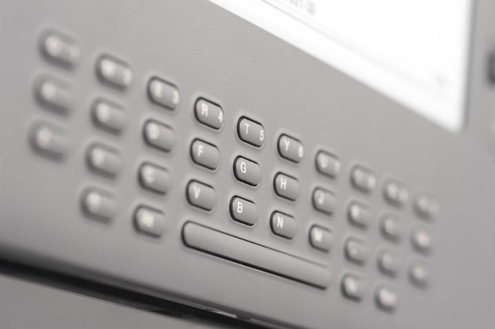 Close Up Detail of Electronic Book Reader Keyboard, Selective Focus on Center Keys