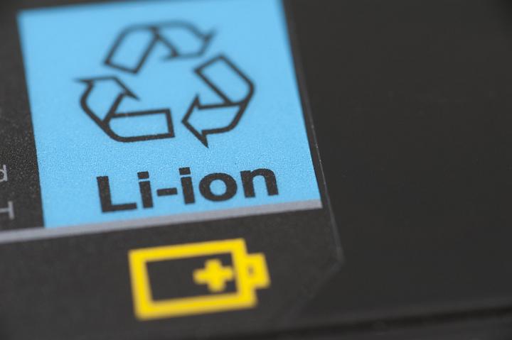 Lithium ion battery labels and icon with focus to the words Li-ion on a blue recycling or recharge label