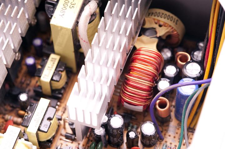 inside of a switchmode power supply unit - psu with heatsink and filter components shown