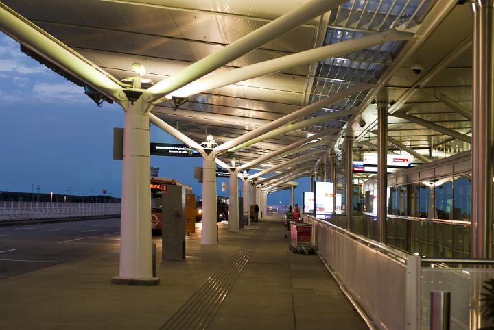 Extensive View of Modern Architectural Airport Terminal Parking at Night Time
