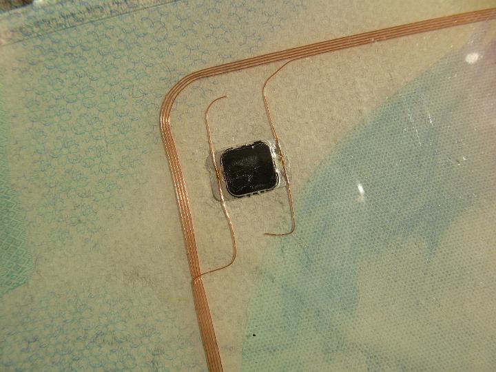 a RF embedded biometric ID chip and loop antenna inside a passport