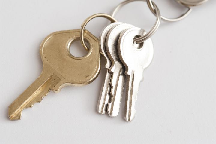 Bunch of luggage keys on a ring to secure baggage on a trip from opportunistic theft by baggage handlers and in hotels